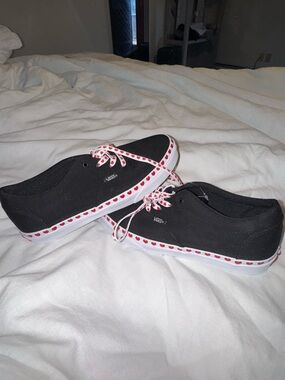 Vans Black Canvas Slip-On Sneakers with Red Heart Trim